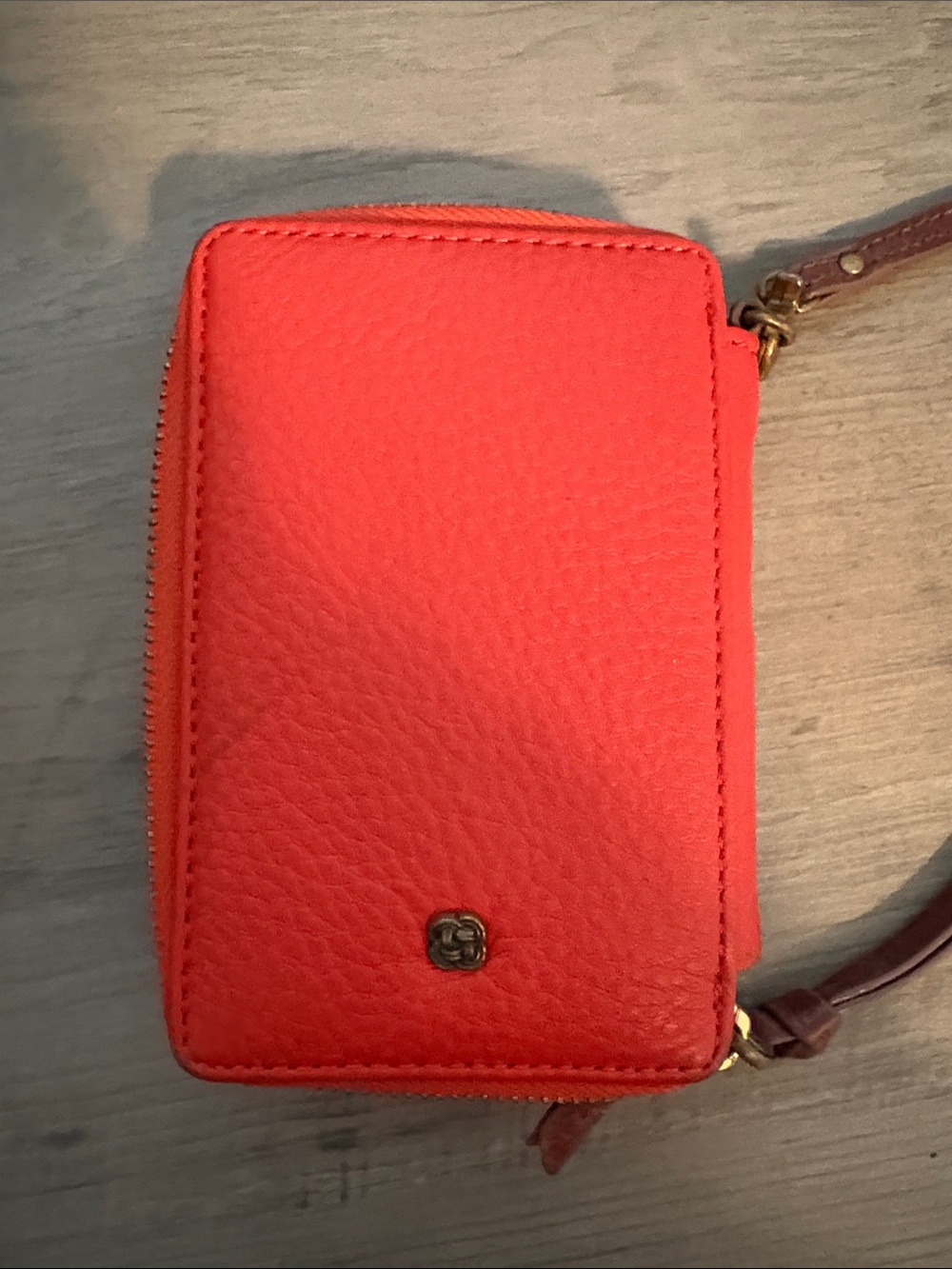 orange leather Elliott Lucca wristlet features a hand-painted peacock feather - Picture 3 of 8